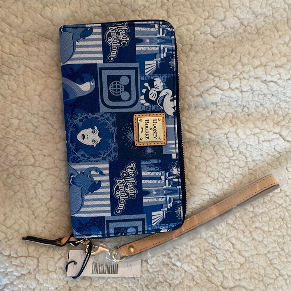 New with tags Magic Kingdom 45th anniversary wallet wristlet. Dooney & Bourke